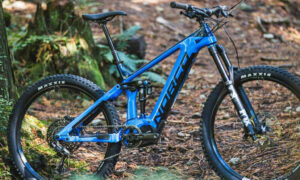 A Norco Sight VLT mountain bike is parked in the woods.
